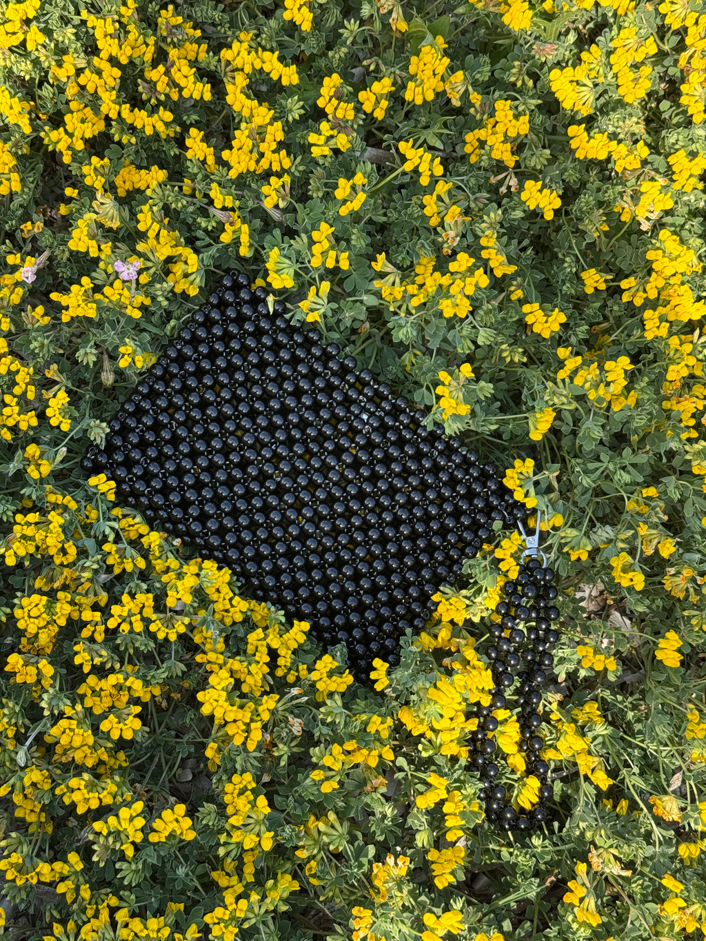 La pochette en perles plastique